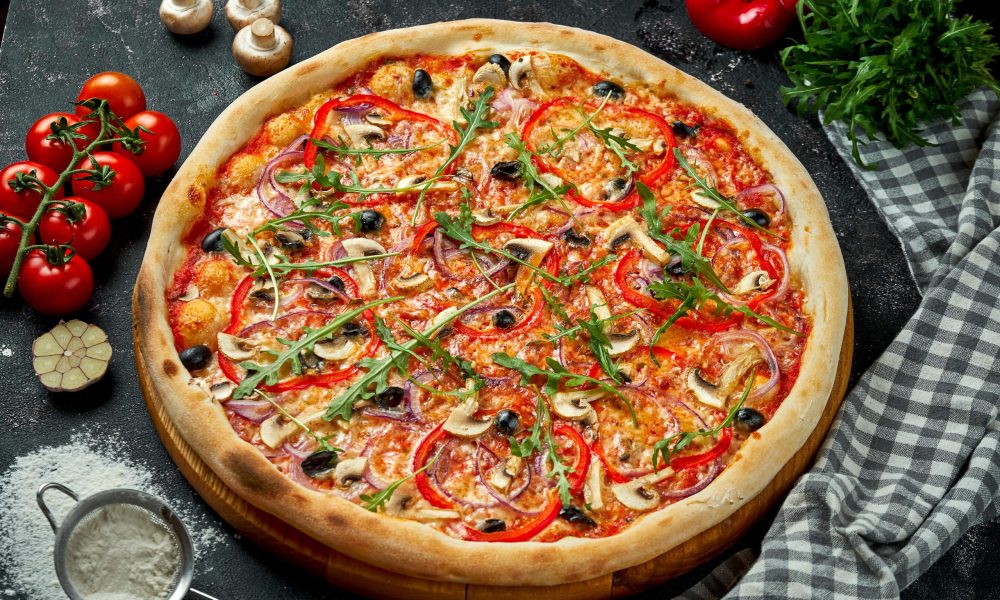 oven-baked-italian-pizza-with-sauce-cheese-mushrooms-bell-peppers-olives-composition-with-ingredients-dark-table-top-view-vegetarian-pizza