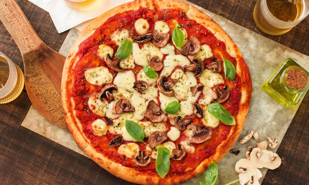 overhead-view-homemade-pizza-with-cheeses-mushroom-basil-leaves